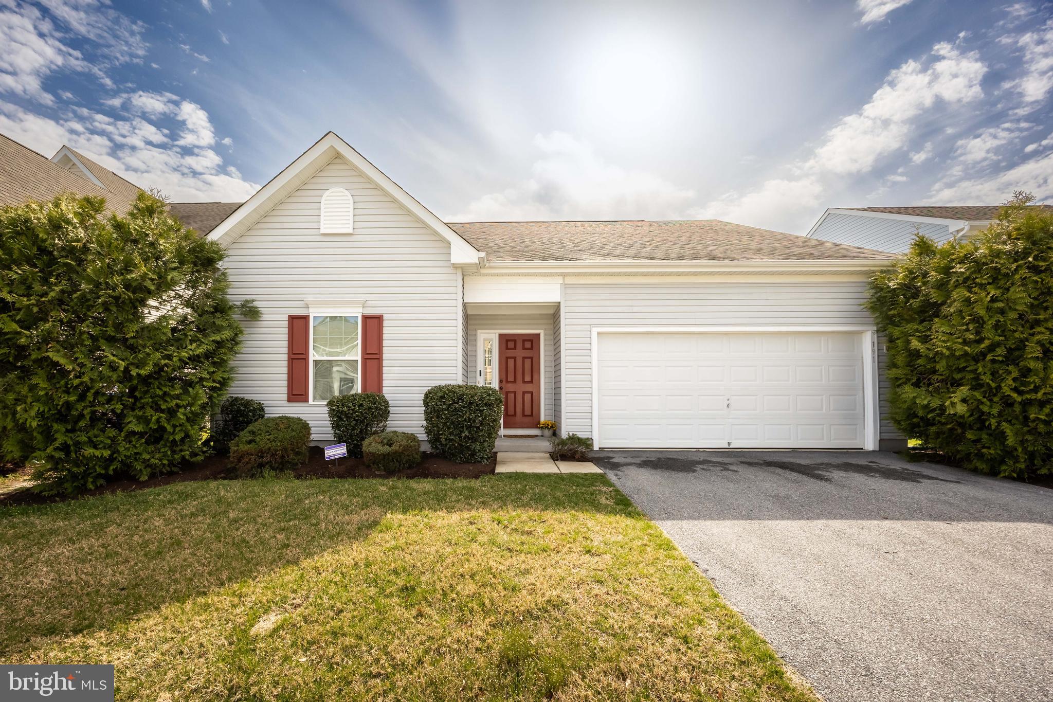191 Bobbys Branch Road Millsboro, DE 19966 - Photo 1 of 40 a front view of a house with a yard and garage