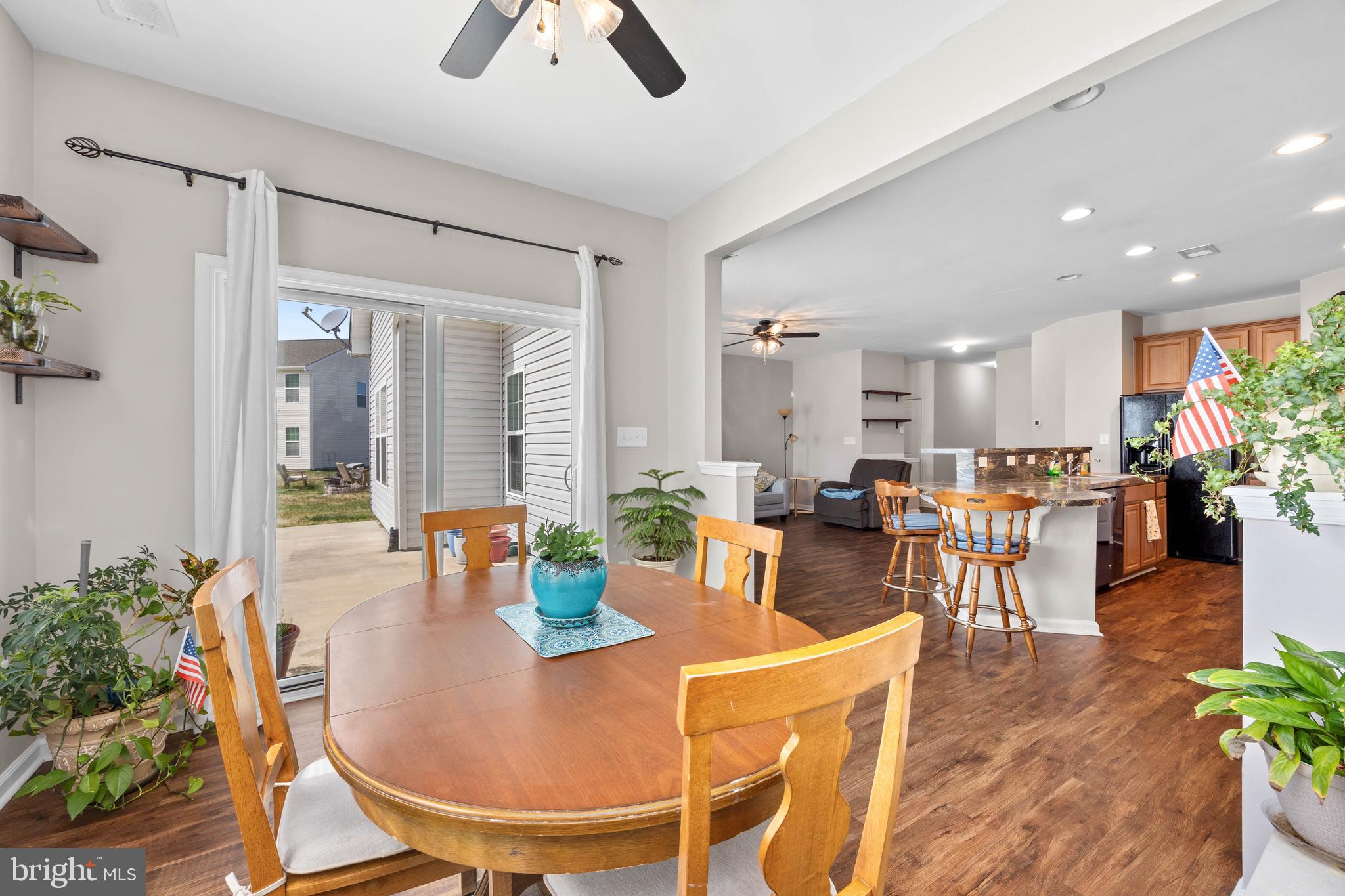 191 Bobbys Branch Road Millsboro, DE 19966 - Photo 14 of 40 a dining room with large glass table and chairs