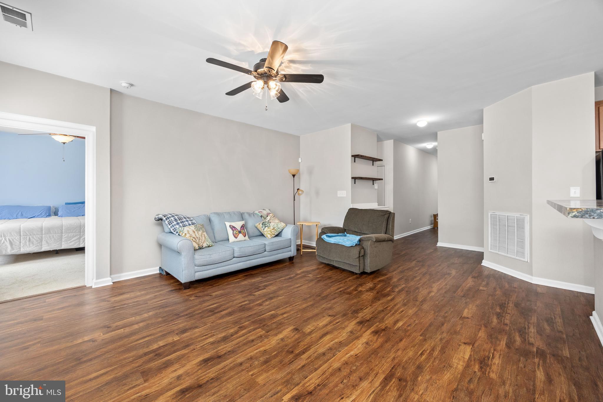 191 Bobbys Branch Road Millsboro, DE 19966 - Photo 15 of 40 a living room with furniture and wooden floor