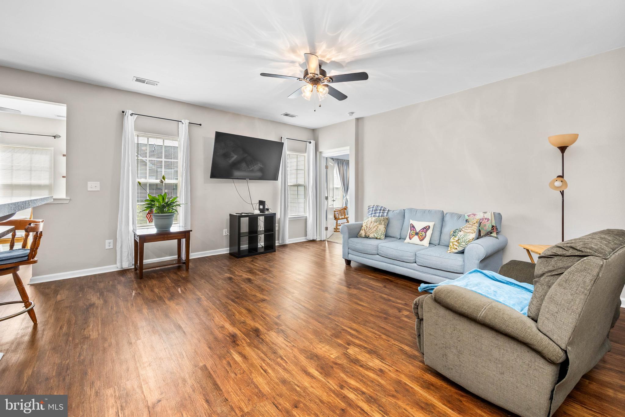 191 Bobbys Branch Road Millsboro, DE 19966 - Photo 16 of 40 a living room with furniture and a flat screen tv