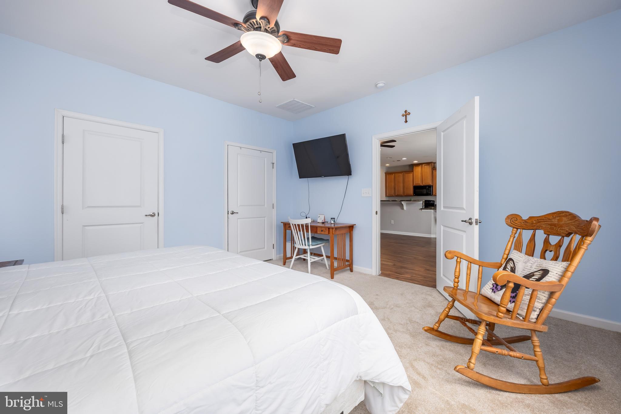 191 Bobbys Branch Road Millsboro, DE 19966 - Photo 21 of 40 a bedroom with a bed and a flat screen tv