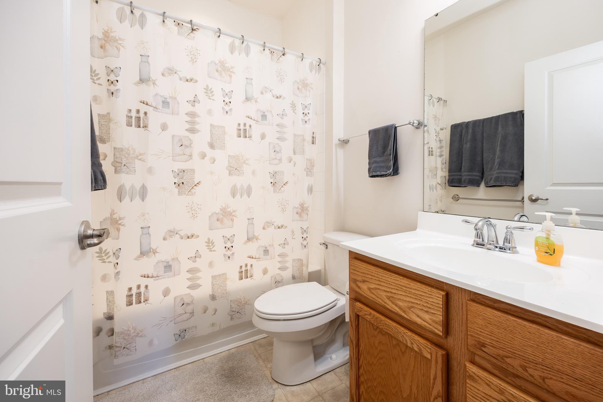 191 Bobbys Branch Road Millsboro, DE 19966 - Photo 25 of 40 a bathroom with a granite countertop toilet sink and mirror