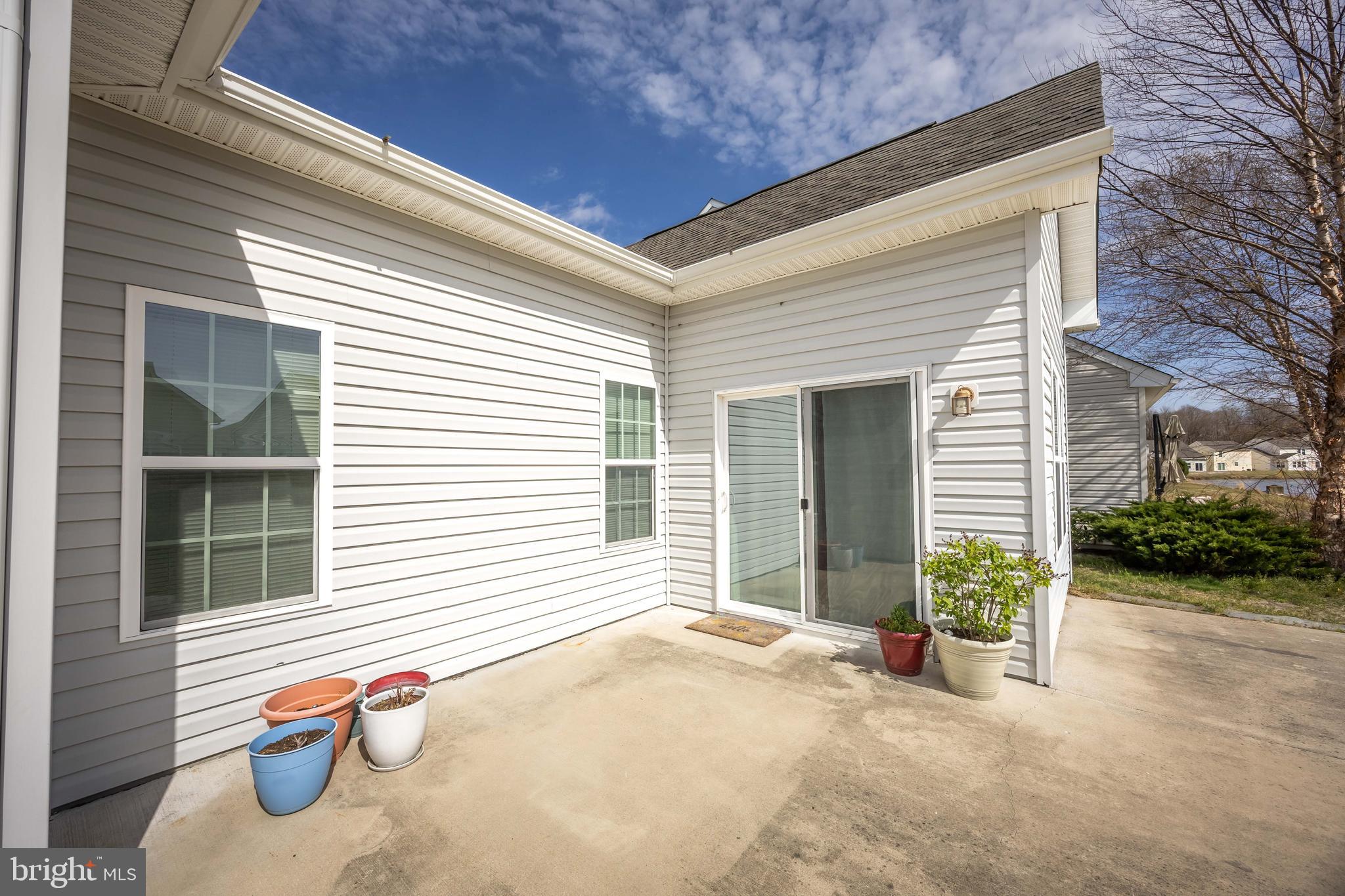 191 Bobbys Branch Road Millsboro, DE 19966 - Photo 36 of 40 a backyard of a house with seating space