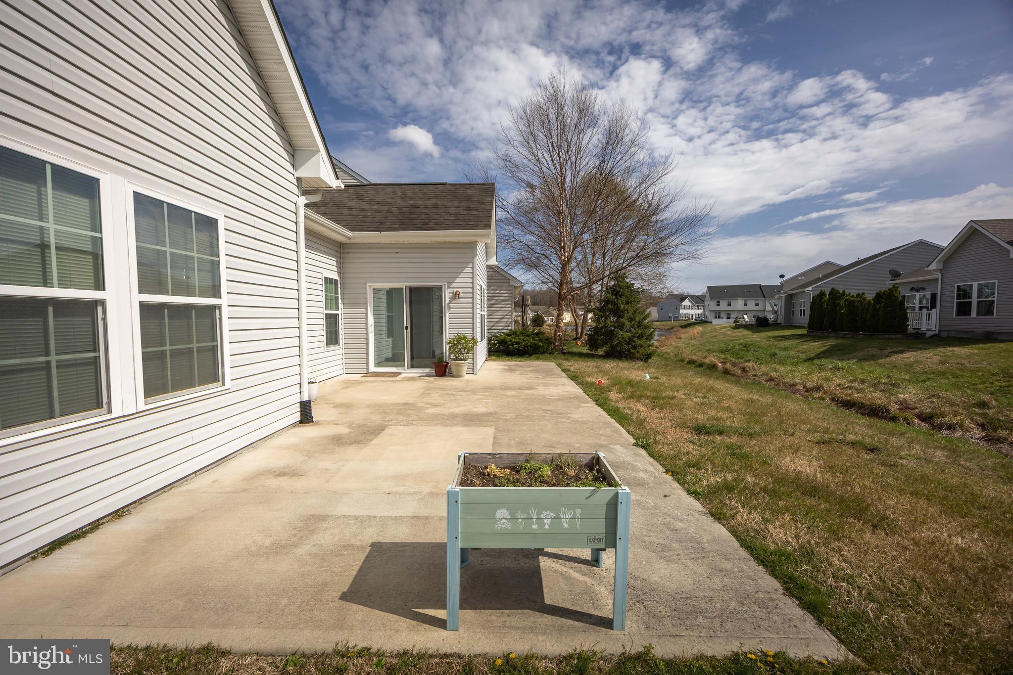 191 Bobbys Branch Road Millsboro, DE 19966 - Photo 37 of 40 a view of a white house with a yard