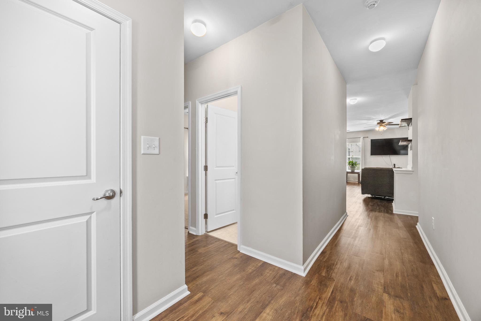 191 Bobbys Branch Road Millsboro, DE 19966 - Photo 4 of 40 a view of a kitchen from the hallway with a wooden floor