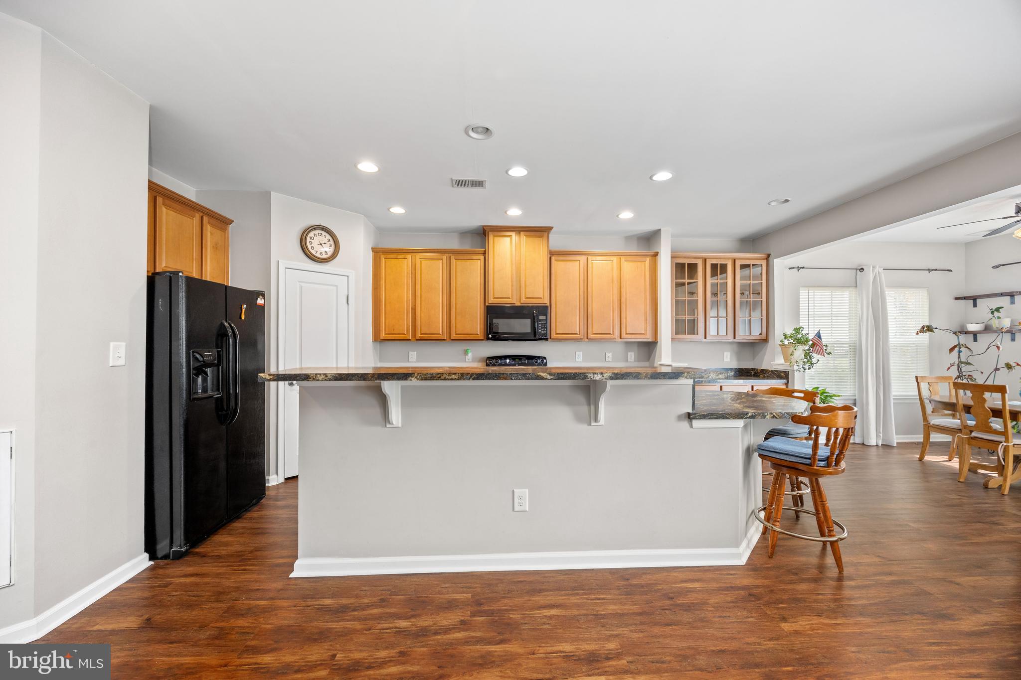 191 Bobbys Branch Road Millsboro, DE 19966 - Photo 6 of 40 a view of kitchen with stainless steel appliances granite countertop a refrigerator and a stove top oven