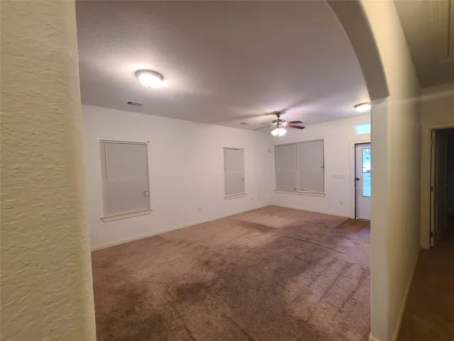 a kitchen with a refrigerator and a stove
