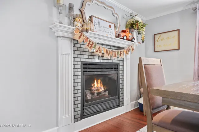 a living room with furniture a fireplace and a fireplace