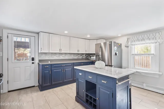 a kitchen with a sink stove and refrigerator
