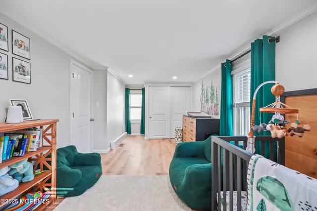 a living room with furniture and a book shelf
