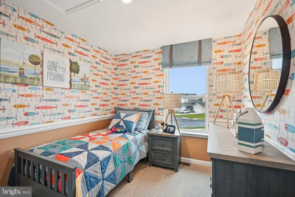 a bedroom with a bed and a table in it