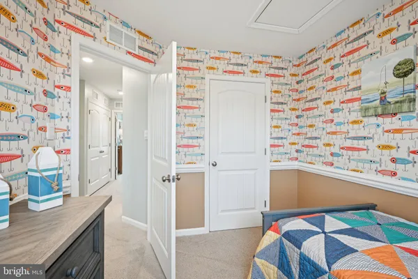 a utility room with stainless steel appliances and cabinets