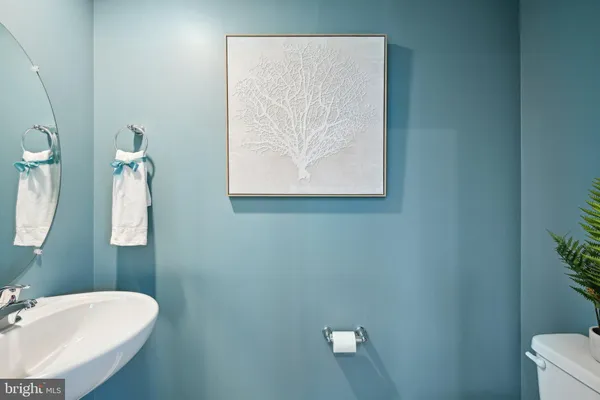 a bathroom with a toilet and a sink