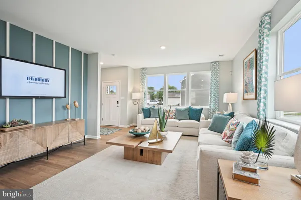 a living room with furniture and a table