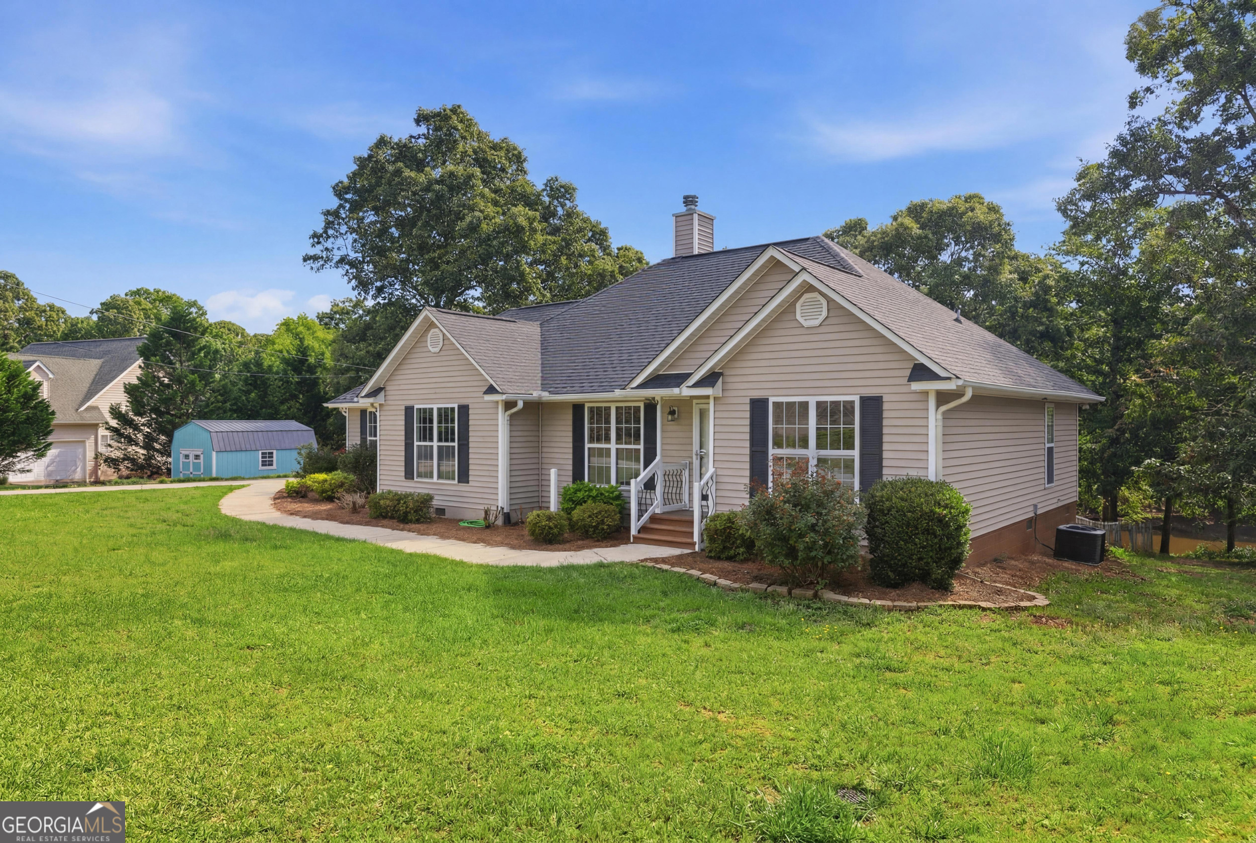 171 Winding Way Hartwell, GA 30643 - Photo 7 of 37 a front view of a house with garden and porch