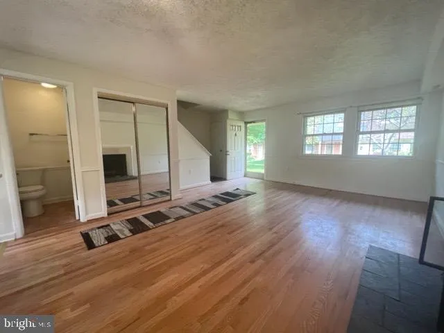 a view of a livingroom with furniture and a fireplace