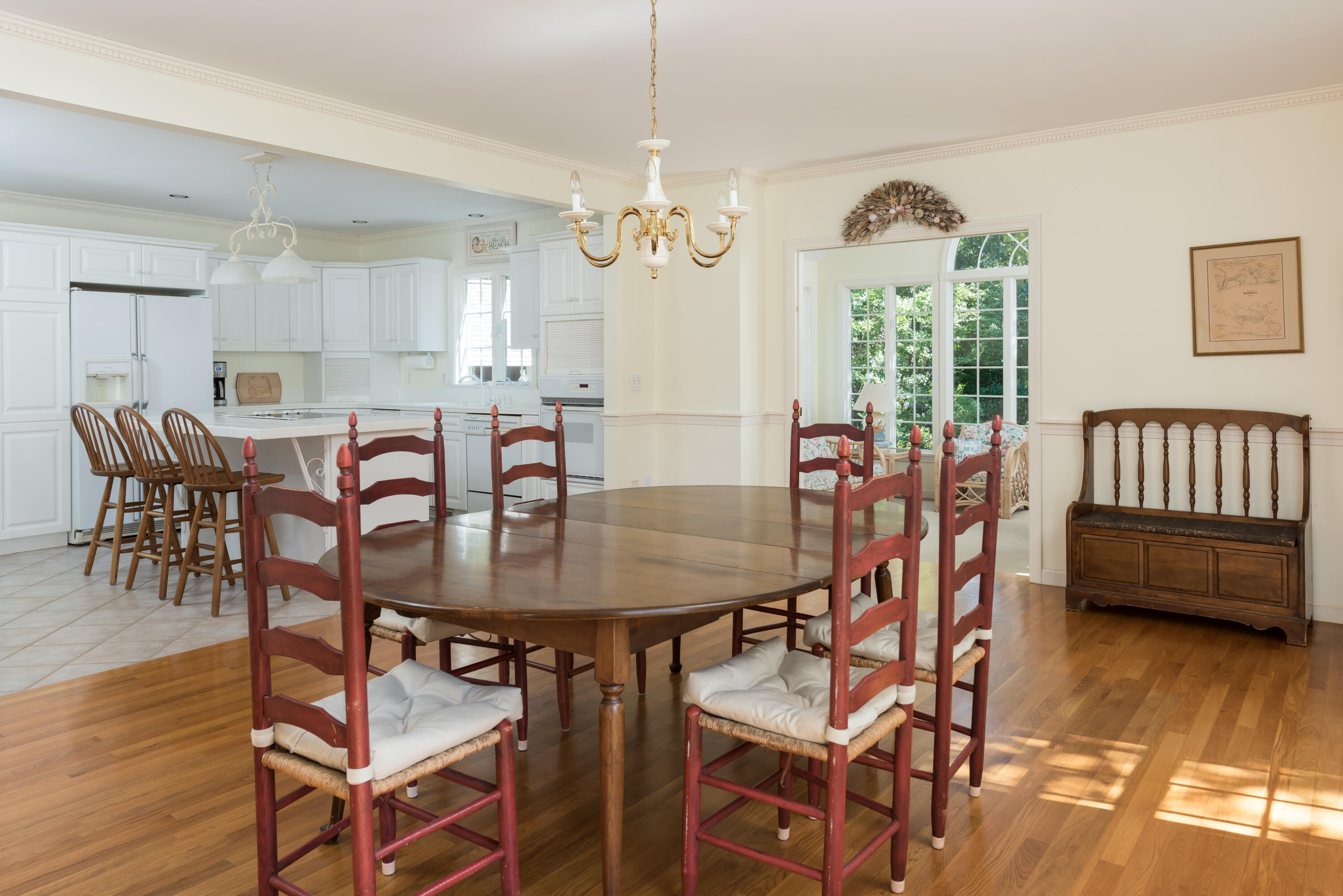 280 Lower County Road Harwich Port, MA 02646 - Photo 11 of 34 a view of a dining room with furniture and wooden floor