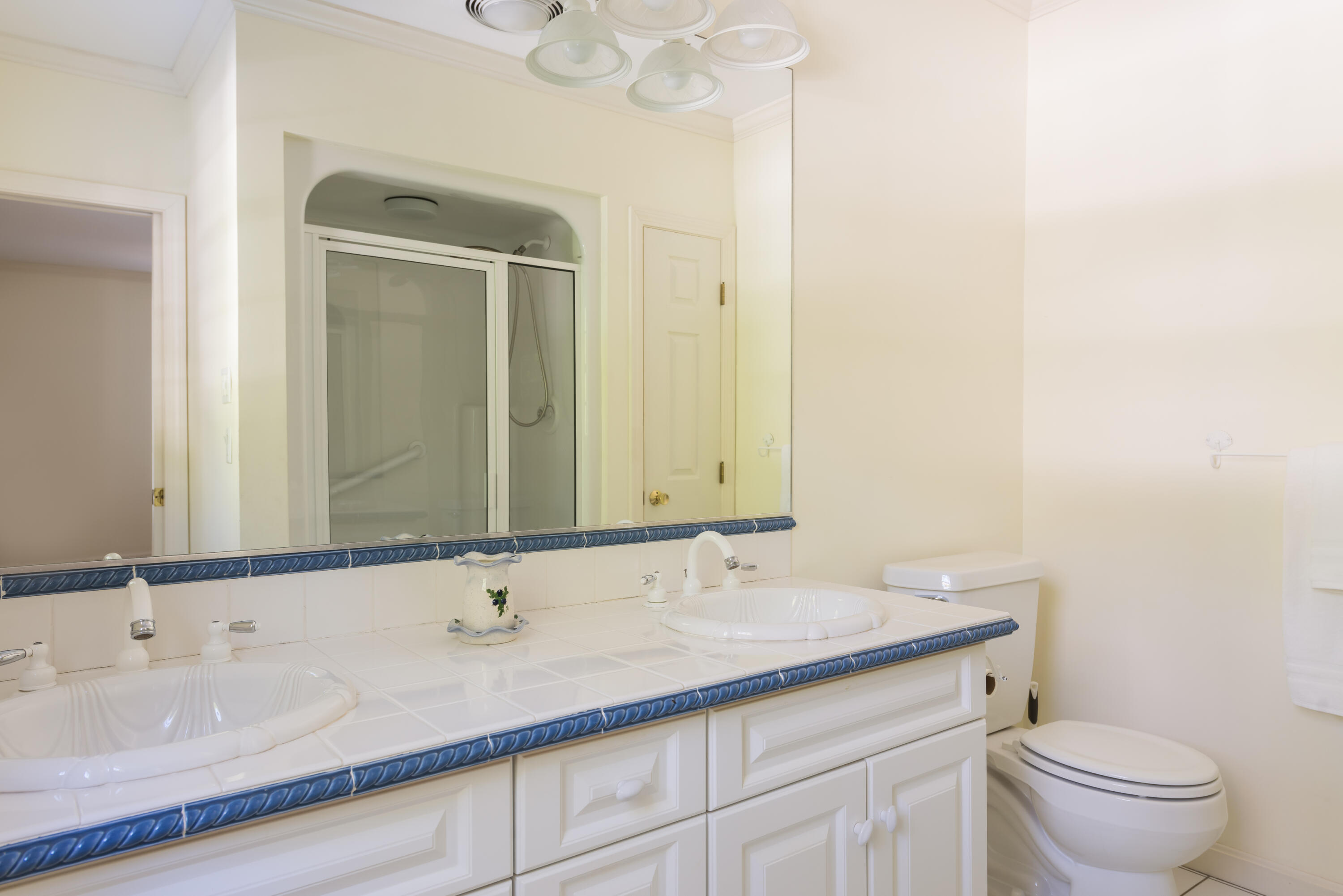 280 Lower County Road Harwich Port, MA 02646 - Photo 20 of 34 a bathroom with a granite countertop sink a toilet and a mirror