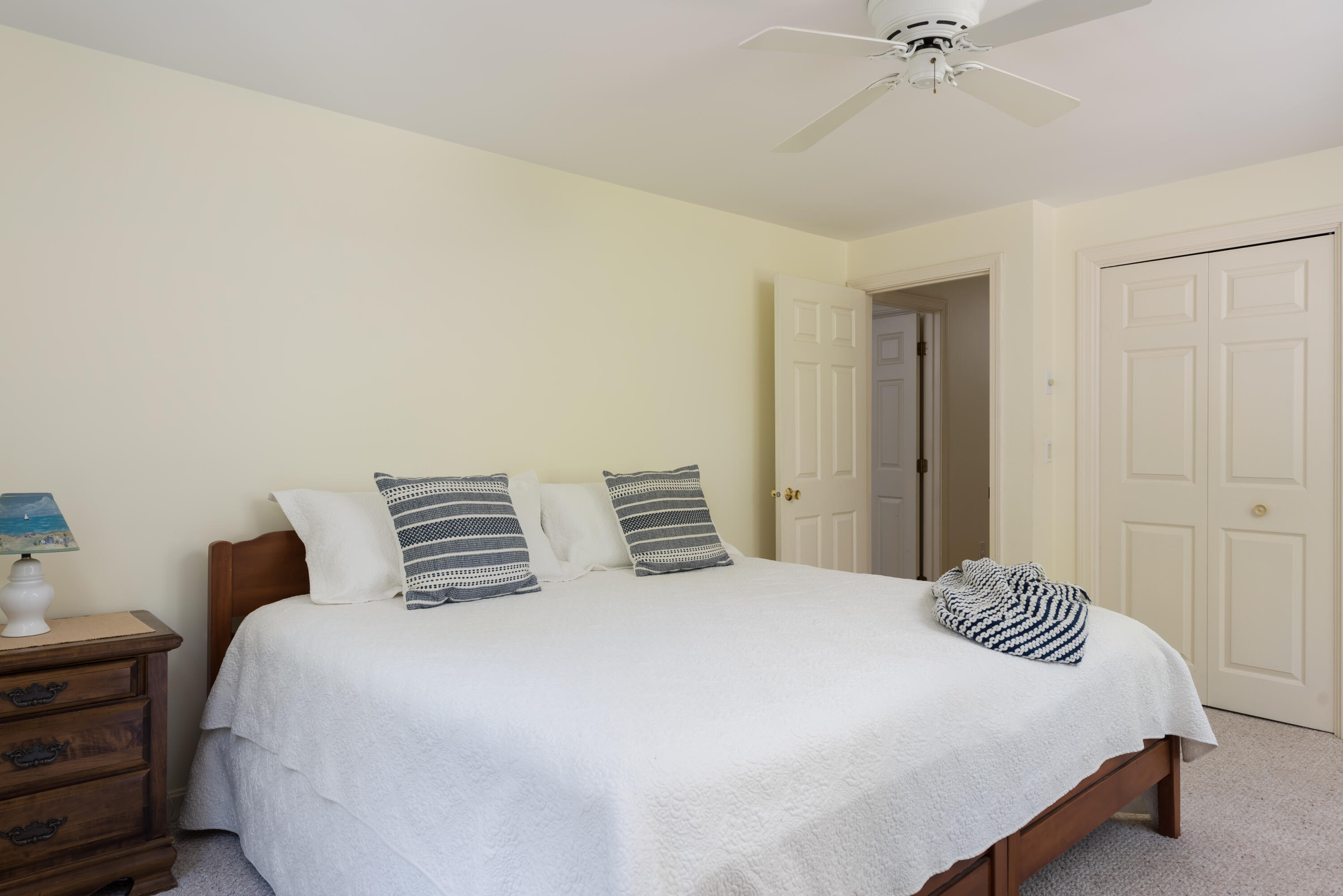 280 Lower County Road Harwich Port, MA 02646 - Photo 21 of 34 a bedroom with a bed and a chandelier