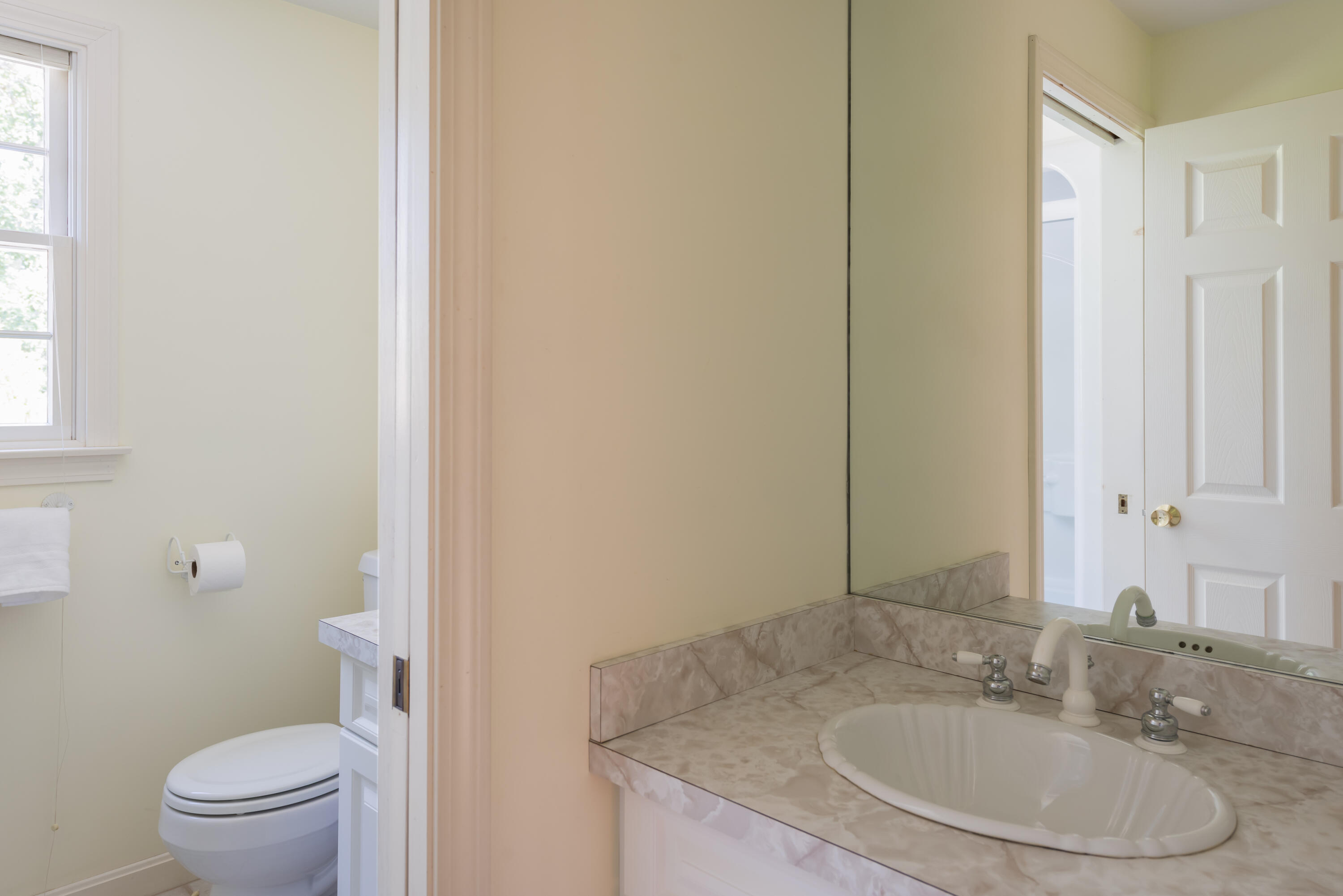 280 Lower County Road Harwich Port, MA 02646 - Photo 25 of 34 a bathroom with a granite countertop sink toilet and a mirror