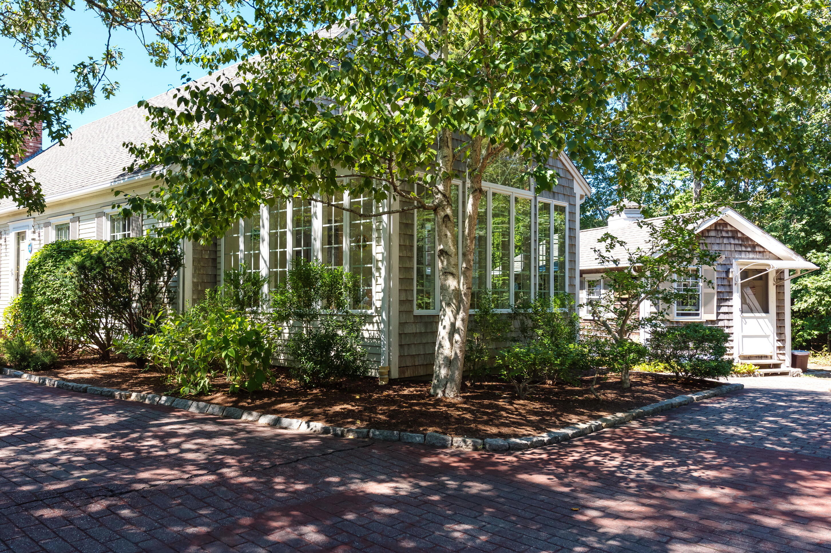 280 Lower County Road Harwich Port, MA 02646 - Photo 28 of 34 a pathway of a house with potted plants and large trees