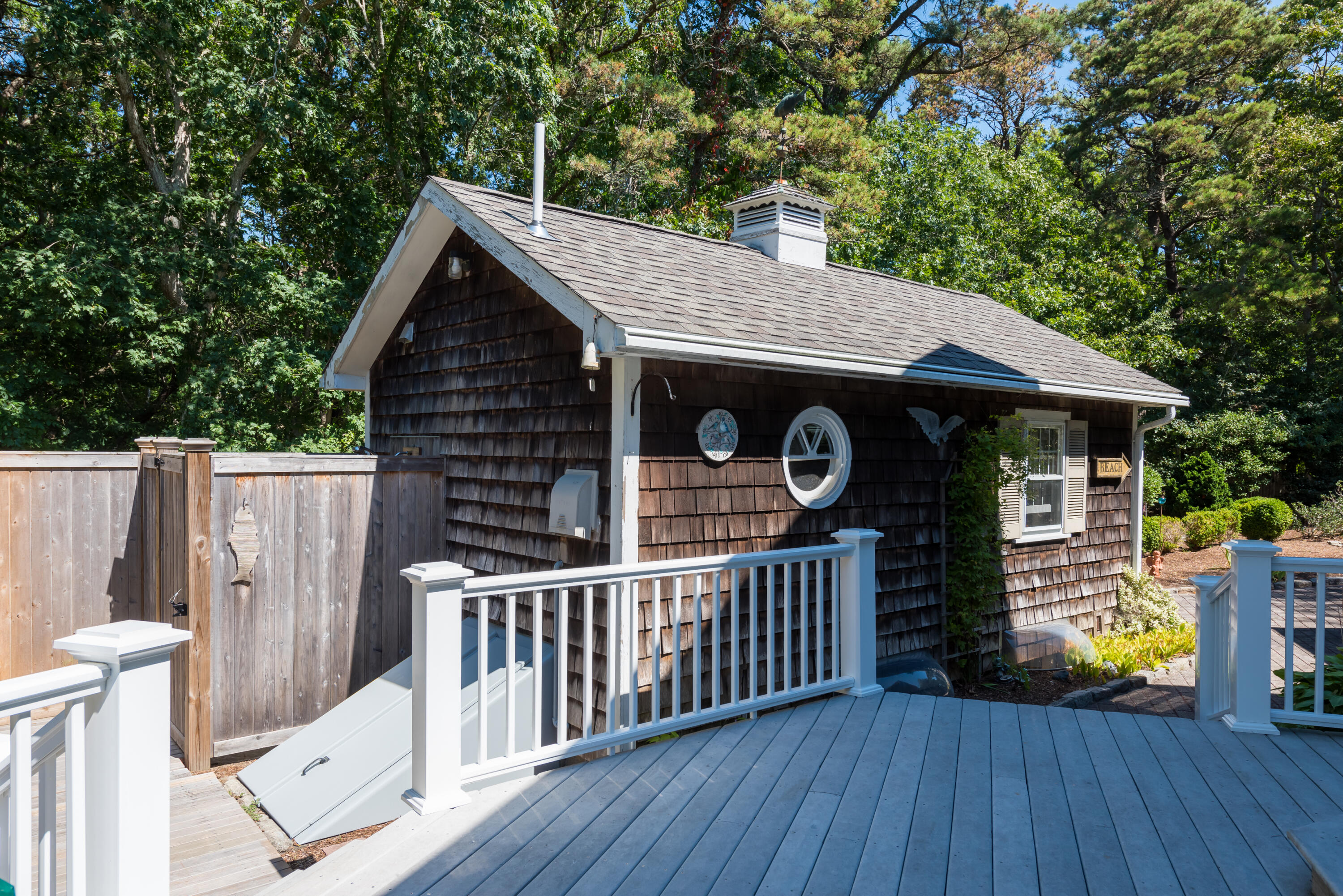 280 Lower County Road Harwich Port, MA 02646 - Photo 29 of 34 a view of a small house with wooden deck and furniture