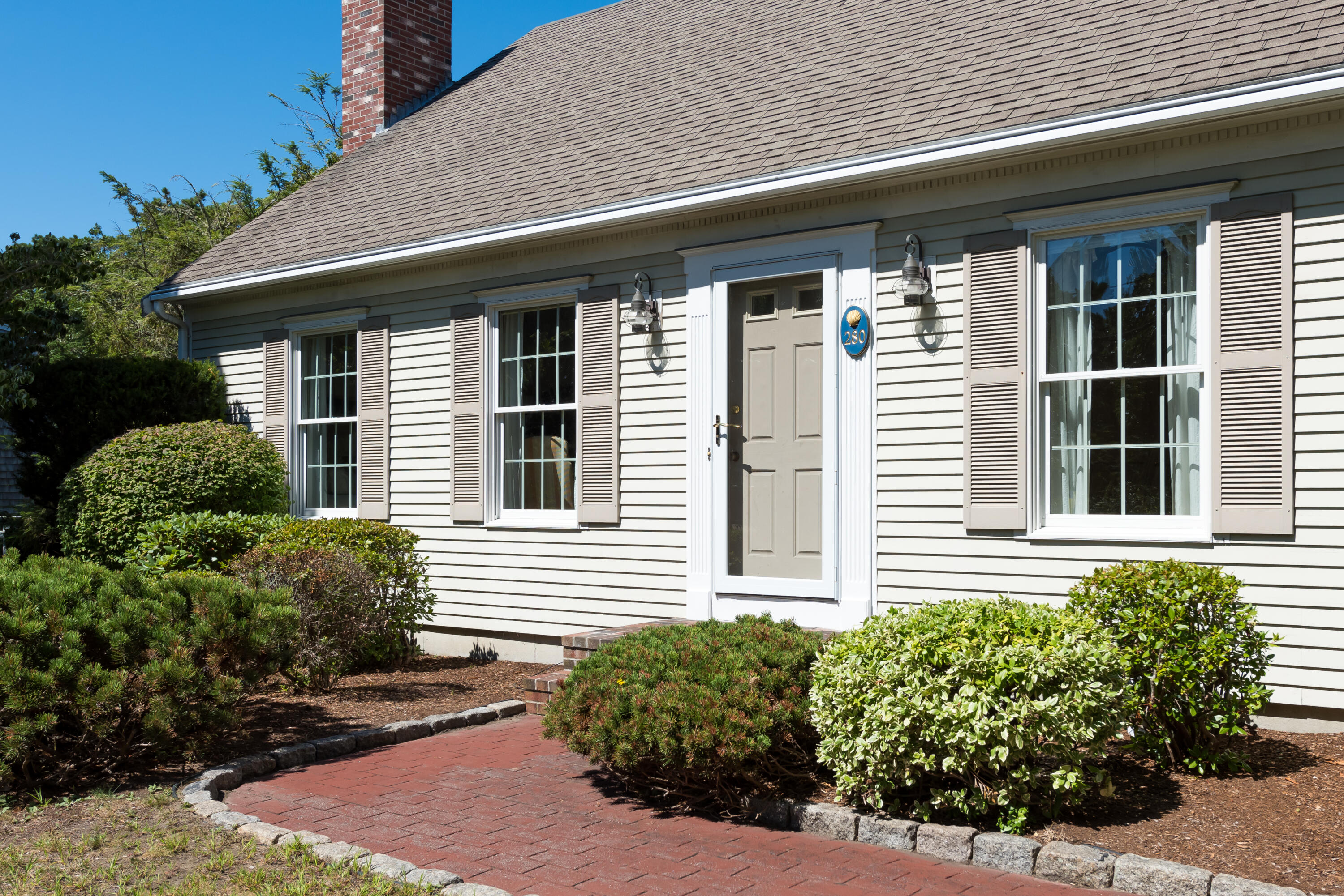 280 Lower County Road Harwich Port, MA 02646 - Photo 6 of 34 a front view of a house with plants