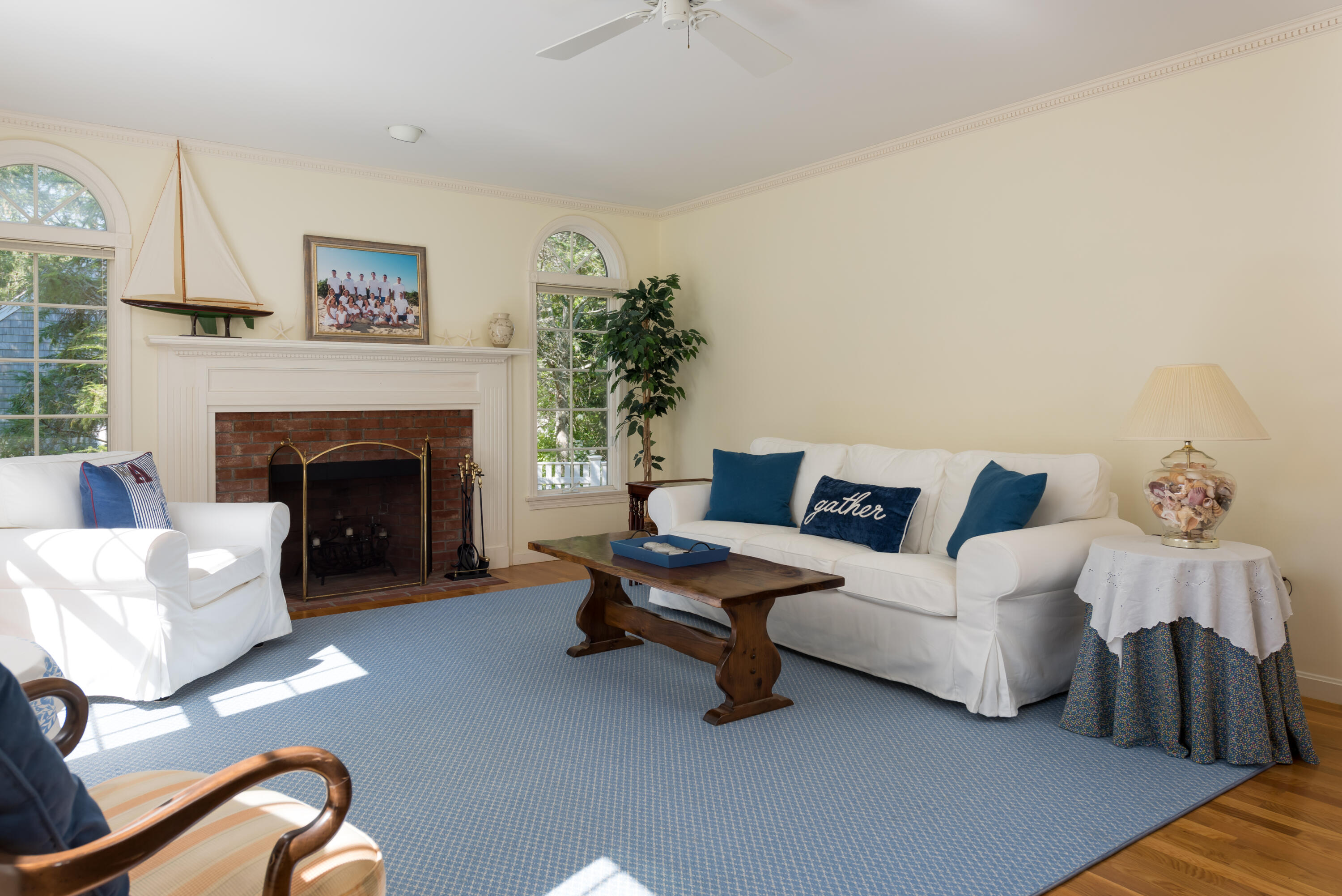 280 Lower County Road Harwich Port, MA 02646 - Photo 8 of 34 a living room with furniture and a fireplace
