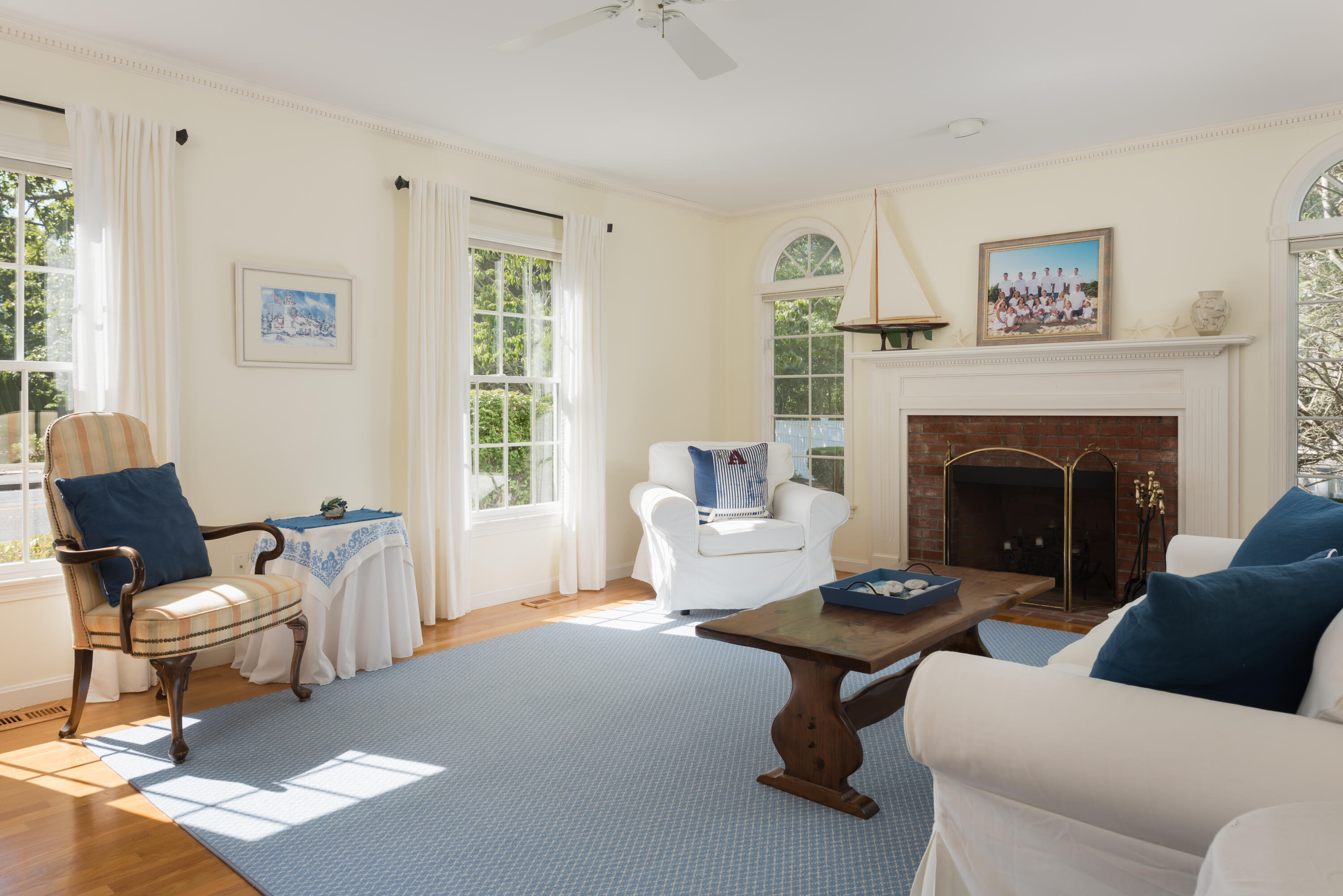 280 Lower County Road Harwich Port, MA 02646 - Photo 9 of 34 a living room with furniture a window and a fireplace