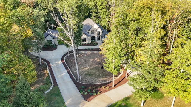 a view of a patio with table and chairs a wooden floor and fence