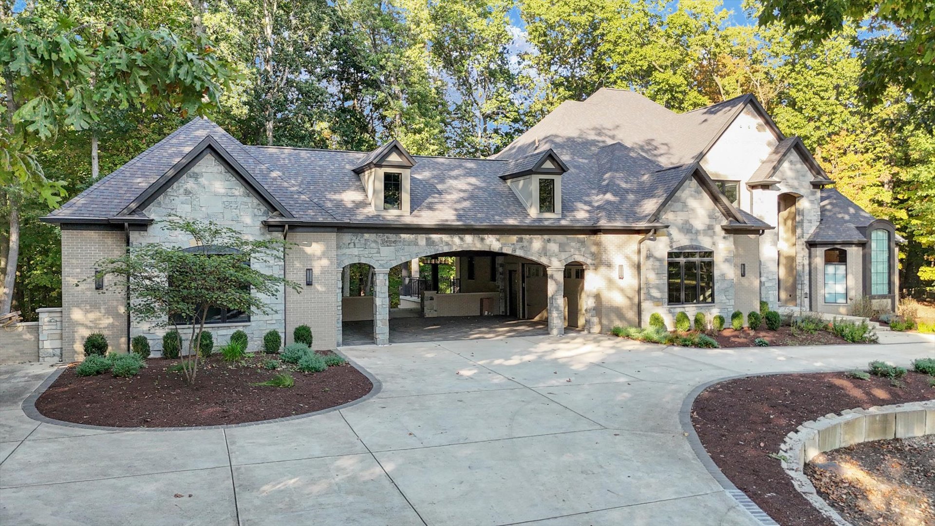 1410 East White Oak Road Mahomet, IL 61853 - Photo 2 of 140 a front view of a house with garden and plants