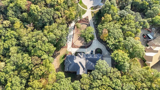 a view of a dining room with furniture large windows and wooden floor