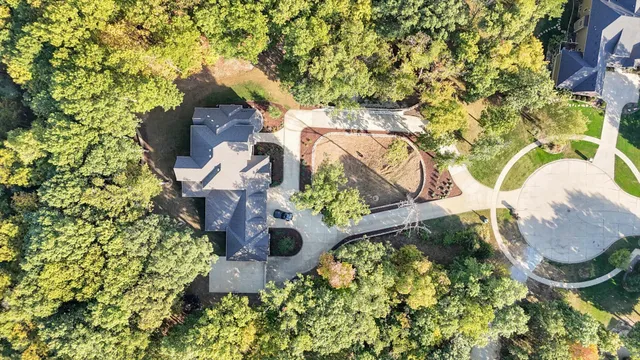 a view of a dining room with furniture large windows and wooden floor