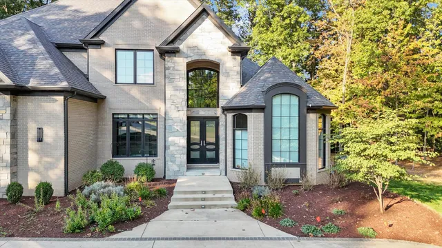 a front view of a house with garden