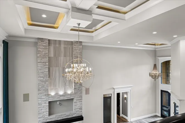 a bathroom with a sink a toilet and a large mirror