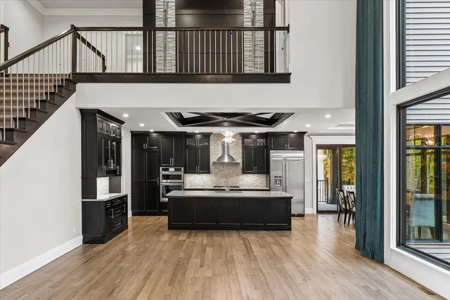 a bathroom with a granite countertop sink a toilet and bathtub
