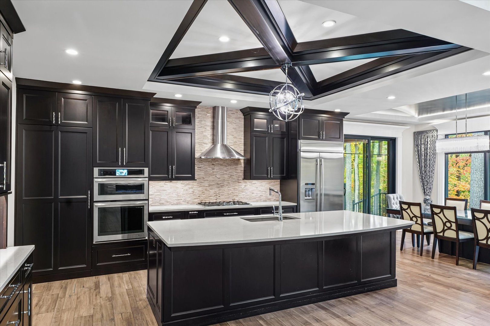 1410 East White Oak Road Mahomet, IL 61853 - Photo 52 of 140 a kitchen with stainless steel appliances granite countertop a stove and a sink