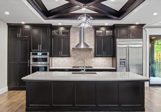 a living room with couches chairs and a flat screen tv
