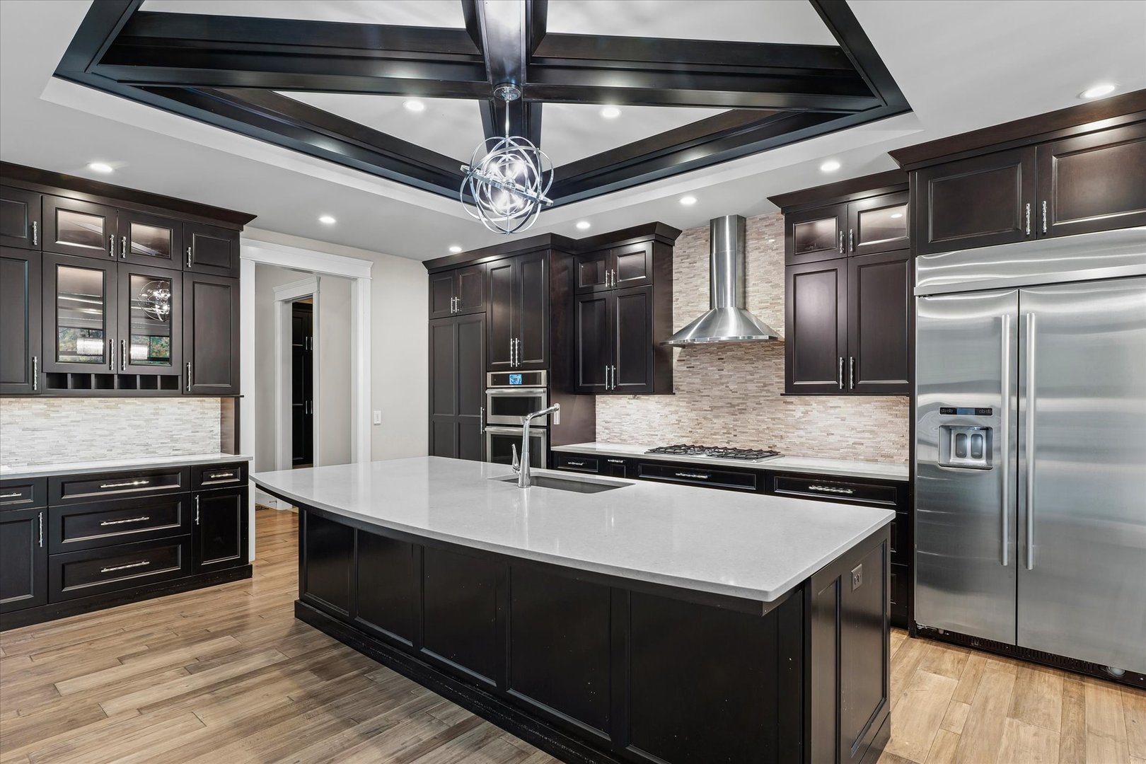 1410 East White Oak Road Mahomet, IL 61853 - Photo 56 of 140 a kitchen with stainless steel appliances granite countertop a sink and a refrigerator