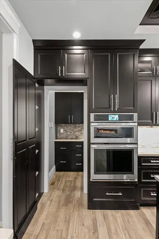 a view of house with yard and sitting area