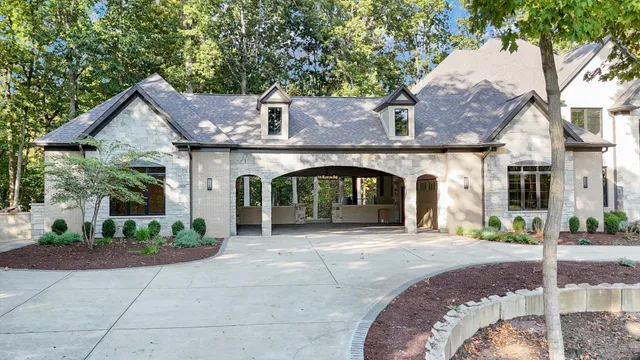 a front view of a house with garden