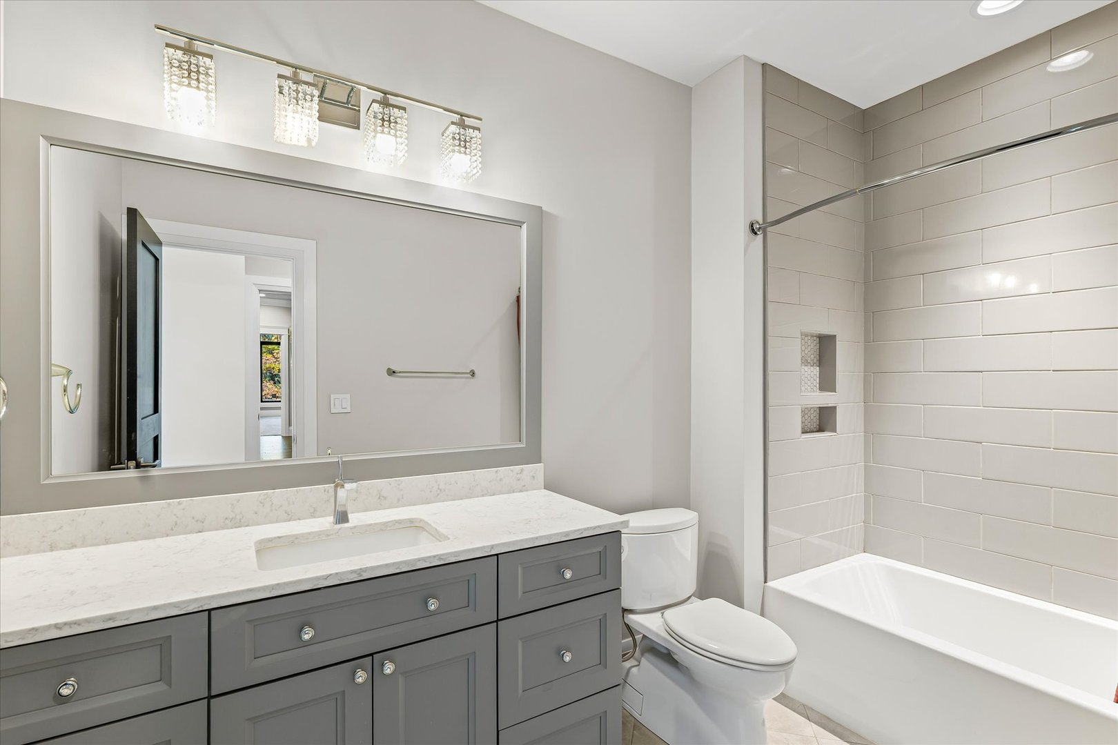 1410 East White Oak Road Mahomet, IL 61853 - Photo 97 of 140 a bathroom with a sink a toilet and a large mirror