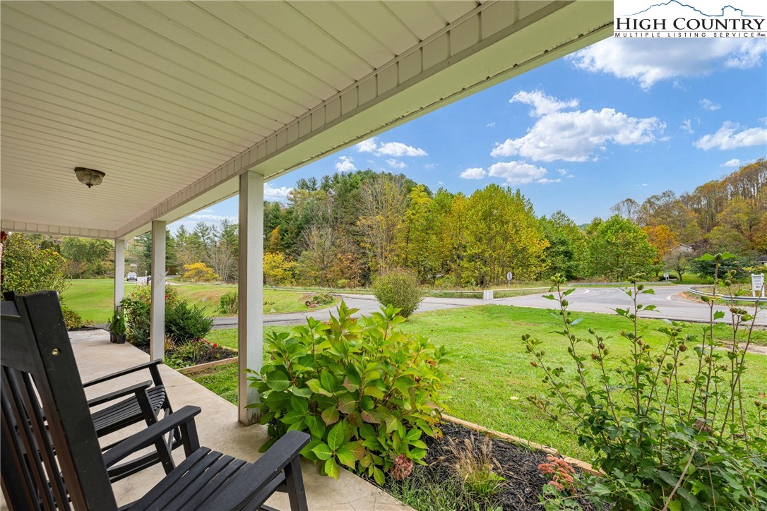 1044 Highway 321 Vilas, NC 28692 - Photo 11 of 47 a view of a porch with furniture and garden