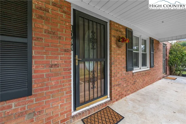 a view of a brick house with windows