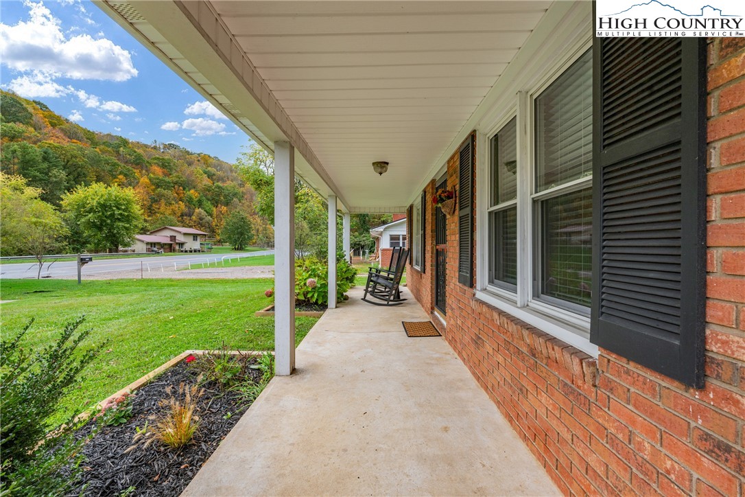 1044 Highway 321 Vilas, NC 28692 - Photo 13 of 47 a view of a house with backyard and porch