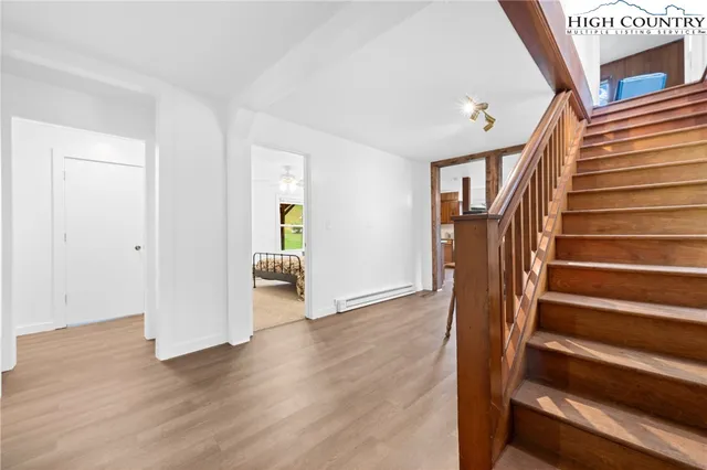 a view of an entryway with wooden floor