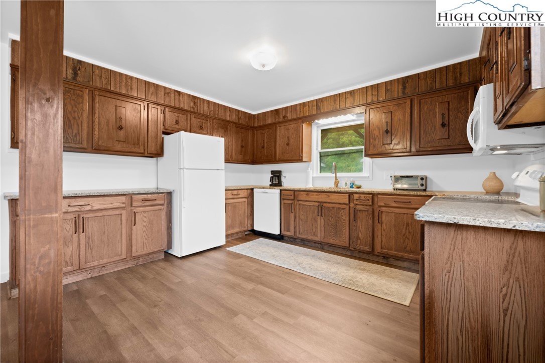 1044 Highway 321 Vilas, NC 28692 - Photo 20 of 47 a kitchen with a sink a window and cabinets