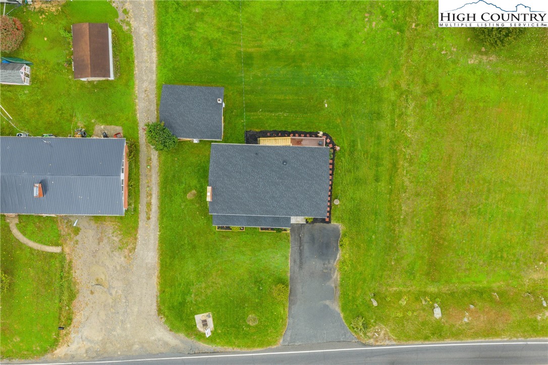 1044 Highway 321 Vilas, NC 28692 - Photo 3 of 47 an aerial view of a house with a yard basket ball court and outdoor seating
