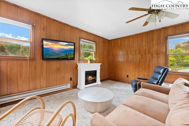 a kitchen with granite countertop stainless steel appliances a sink cabinets and a window