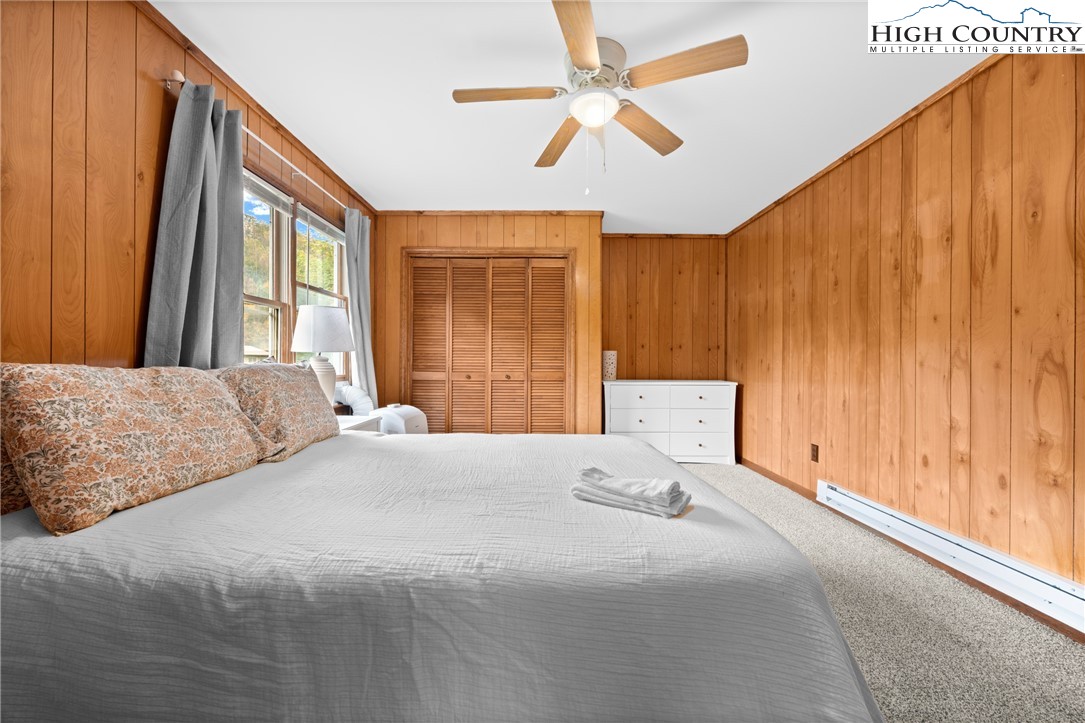 1044 Highway 321 Vilas, NC 28692 - Photo 40 of 47 a bedroom with a large bed and a large window